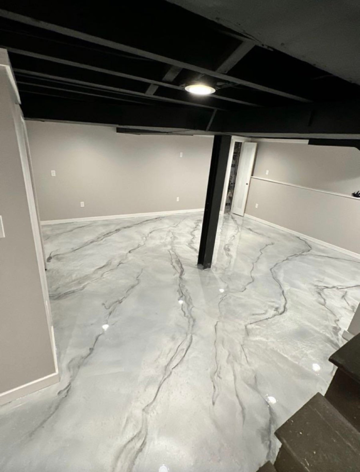 Basement remodel with marble metallic epoxy floor installed by Fox and Fern