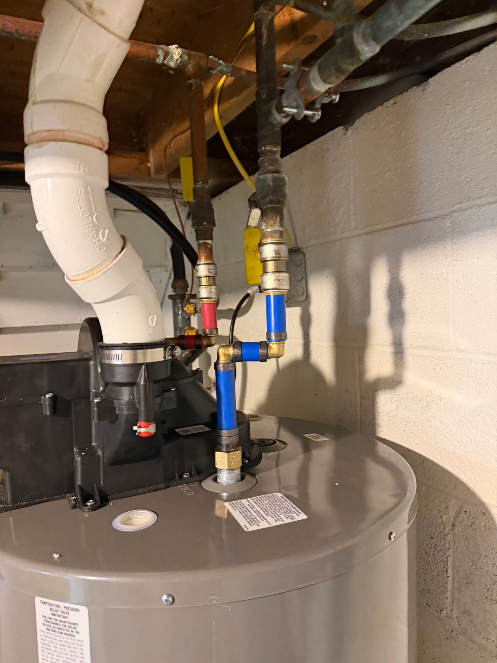 Power vent water heater and PEX plumbing system installed by Fox and Fern