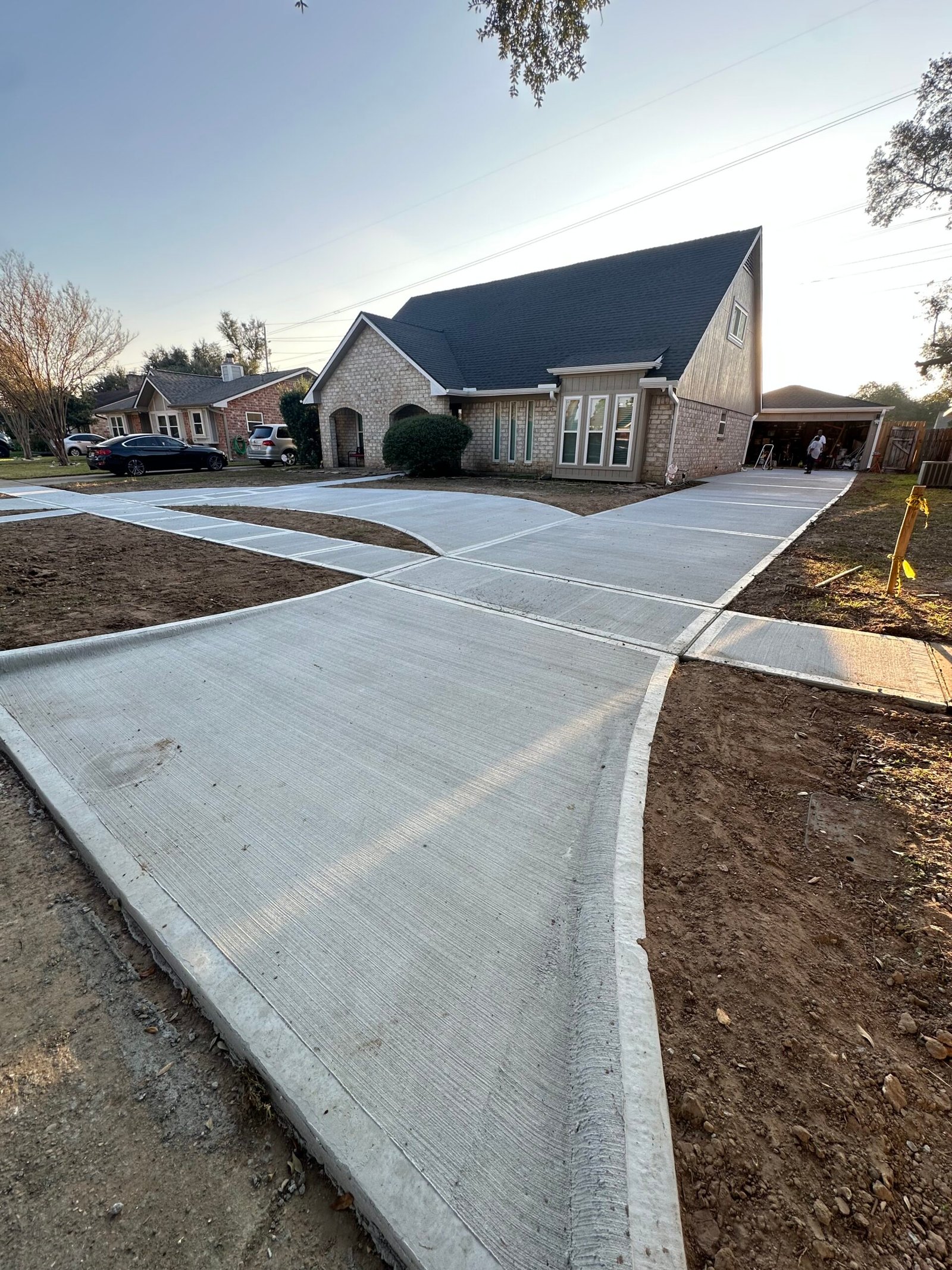Finished concrete driveway replacement by Fox and Fern